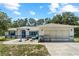 Charming single-Gathering home features a well-manicured front yard and a two-car garage at 2698 Sw 186Th Ct, Dunnellon, FL 34432