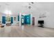Bright living room with wood-look floors, high ceilings, and lots of natural light at 2698 Sw 186Th Ct, Dunnellon, FL 34432