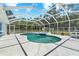 Screened-in pool area featuring a large pool, a jacuzzi and a patio at 2698 Sw 186Th Ct, Dunnellon, FL 34432