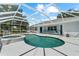 Relaxing screened pool with hot tub and backyard views at 2698 Sw 186Th Ct, Dunnellon, FL 34432