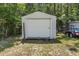 An outdoor storage shed with a roll up door provides extra storage space at 2698 Sw 186Th Ct, Dunnellon, FL 34432