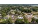 Neighborhood aerial view featuring many mature trees, well-kept lawns, and paved roads at 2819 Ne 32Nd Pl, Ocala, FL 34479