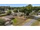 Aerial view of a backyard featuring a shed, a fire pit, and a well-maintained lawn at 2819 Ne 32Nd Pl, Ocala, FL 34479