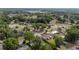 A neighborhood aerial view featuring mature trees, grassy lawns, and well-maintained homes at 2819 Ne 32Nd Pl, Ocala, FL 34479