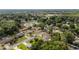 Residential area featuring mature trees and landscaped yards in a suburban neighborhood at 2819 Ne 32Nd Pl, Ocala, FL 34479