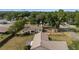 A residential area featuring a fenced backyard with mature trees and a cozy fire pit at 2819 Ne 32Nd Pl, Ocala, FL 34479