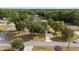 A lovely home featuring mature trees, a well maintained lawn, and a paved driveway at 2819 Ne 32Nd Pl, Ocala, FL 34479
