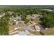 An aerial view of the neighborhood featuring mature trees, well-manicured lawns, and paved streets at 2819 Ne 32Nd Pl, Ocala, FL 34479