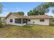 Spacious backyard featuring a well-maintained lawn and a cozy screened in porch for outdoor relaxation and entertaining at 2819 Ne 32Nd Pl, Ocala, FL 34479