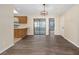 Dining area featuring wood-look flooring, modern lighting, and sliding glass doors at 2819 Ne 32Nd Pl, Ocala, FL 34479