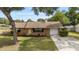 Charming single-story brick home featuring a well-maintained lawn and attached one car garage at 2819 Ne 32Nd Pl, Ocala, FL 34479
