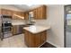 Kitchen with stainless steel appliances, breakfast bar and updated cabinetry at 2819 Ne 32Nd Pl, Ocala, FL 34479