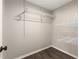 A walk-in closet with custom shelving and wood-look flooring provides ample storage space at 2819 Ne 32Nd Pl, Ocala, FL 34479
