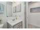 Bright bathroom with a vanity sink and access to a linen closet at 36 Gordon Ct, Leesburg, FL 34788