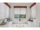 Bright bathroom with a window view and decorative details at 36 Gordon Ct, Leesburg, FL 34788