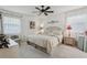 This bedroom features a ceiling fan, neutral decor, and a comfortable bed at 36 Gordon Ct, Leesburg, FL 34788