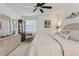 Cozy bedroom with a decorative display cabinet and a ceiling fan at 36 Gordon Ct, Leesburg, FL 34788