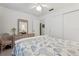 Cozy bedroom with a ceiling fan and neutral colored comforter at 36 Gordon Ct, Leesburg, FL 34788