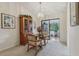 Cozy dining area with natural light and carpet flooring at 36 Gordon Ct, Leesburg, FL 34788