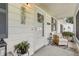 Cozy front porch with a welcoming floral wreath and seating area at 36 Gordon Ct, Leesburg, FL 34788
