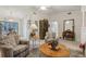 Bright living room with neutral tones, comfortable seating, and ample natural light at 36 Gordon Ct, Leesburg, FL 34788