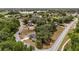 Neighborhood aerial view showcases a home with mature trees and landscaping at 361 Oak Lane Drive Dr, Ocala, FL 34472