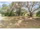 Lush backyard with large trees creating a private and serene environment at 361 Oak Lane Drive Dr, Ocala, FL 34472