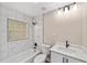 Updated bathroom featuring a tub, shower, modern fixtures and marble-look tile at 361 Oak Lane Drive Dr, Ocala, FL 34472