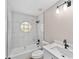 Updated bathroom featuring a tub, shower, modern fixtures and marble-look tile at 361 Oak Lane Drive Dr, Ocala, FL 34472