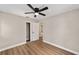 Bedroom featuring wood-look floors, ceiling fan, and closet at 361 Oak Lane Drive Dr, Ocala, FL 34472