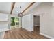 Dining area showcases wood-look flooring, beamed ceiling, storage, and sliding glass doors leading to the outside at 361 Oak Lane Drive Dr, Ocala, FL 34472