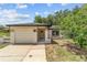 Charming single-story home featuring a well-manicured lawn and attached one car garage at 361 Oak Lane Drive Dr, Ocala, FL 34472