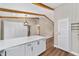 Kitchen with breakfast bar, beamed ceilings, and lots of storage space adjacent to living area at 361 Oak Lane Drive Dr, Ocala, FL 34472