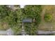 Overhead shot of a charming home embraced by lush trees, offering a sense of privacy and seclusion at 3800 Ne 24Th Ct, Ocala, FL 34479