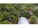 Bird's-eye view of a home featuring mature trees, blending natural beauty with residential comfort at 3800 Ne 24Th Ct, Ocala, FL 34479
