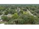 Scenic aerial view of homes nestled among mature trees, offering privacy and a tranquil setting at 3800 Ne 24Th Ct, Ocala, FL 34479