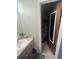 Vanity adjacent to the toilet room with storage at 3800 Ne 24Th Ct, Ocala, FL 34479