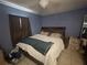 Bedroom with a bed, wood accents and carpeted floor at 3800 Ne 24Th Ct, Ocala, FL 34479