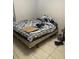 Bedroom with neutral tile flooring, bright natural light, and space for relaxing after a long day at 3800 Ne 24Th Ct, Ocala, FL 34479