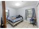 Cozy bedroom with tile floor and windows bringing natural light at 3800 Ne 24Th Ct, Ocala, FL 34479