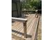 Wooden deck providing a cozy outdoor space for entertaining, relaxing, and enjoying the surrounding nature at 3800 Ne 24Th Ct, Ocala, FL 34479