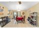 Cozy dining area with a red-covered table and an abundance of natural light at 3800 Ne 24Th Ct, Ocala, FL 34479