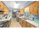 Charming kitchen boasts views of the backyard from its well lit window, with stainless steel appliances at 3800 Ne 24Th Ct, Ocala, FL 34479
