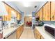 Spacious kitchen with light wood cabinets, lots of counter space, stainless steel appliances, with views to dining area at 3800 Ne 24Th Ct, Ocala, FL 34479