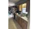 Practical kitchen with stainless steel appliances and abundant counter space near laundry at 3800 Ne 24Th Ct, Ocala, FL 34479