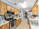 Well-equipped kitchen with stainless steel appliances, plenty of counter space and cabinet storage at 3800 Ne 24Th Ct, Ocala, FL 34479