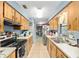 Functional kitchen featuring ample cabinetry and counter space, complemented by modern appliances at 3800 Ne 24Th Ct, Ocala, FL 34479