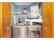 Convenient laundry room area features modern stainless steel washer and dryer for easy care at 3800 Ne 24Th Ct, Ocala, FL 34479