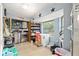 Laundry area with lots of space, washer/dryer, freezer, shelves for storage, and large window at 3800 Ne 24Th Ct, Ocala, FL 34479