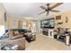 Inviting living room with a ceiling fan, natural light, tile floors and decor at 3800 Ne 24Th Ct, Ocala, FL 34479